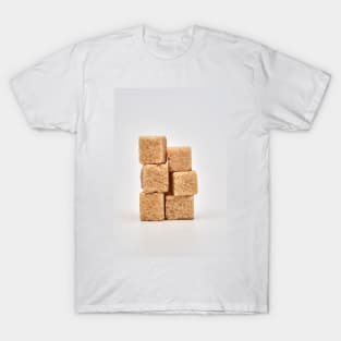 Closeup of brown sugar cubes on white T-Shirt